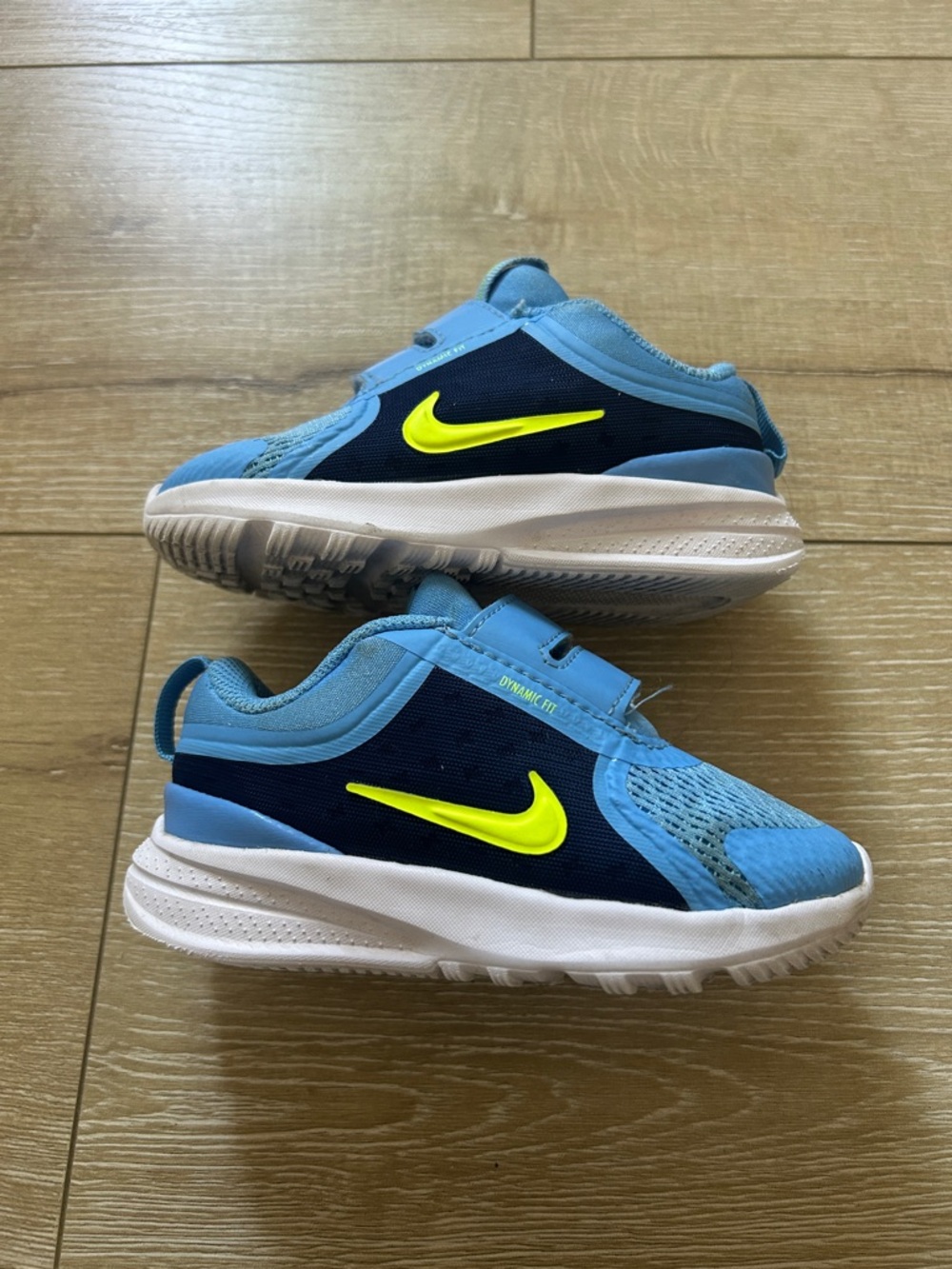 Nike Kids Light Blue and Navy Sneakers with Neon Yellow Swoosh